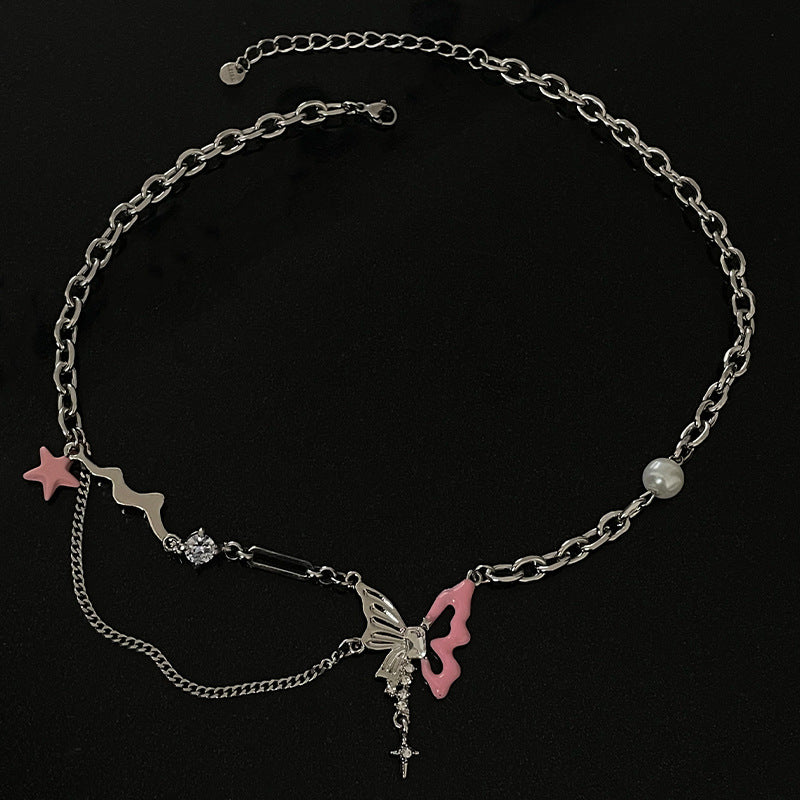 Close-up of pink butterfly star pearl cross layered chain choker necklace
