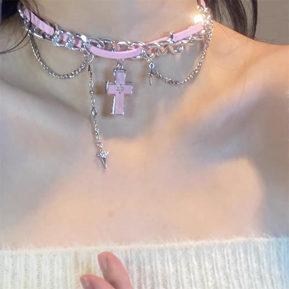 Y2K pink leather layered choker with pink cross and star drop pendant on female neck