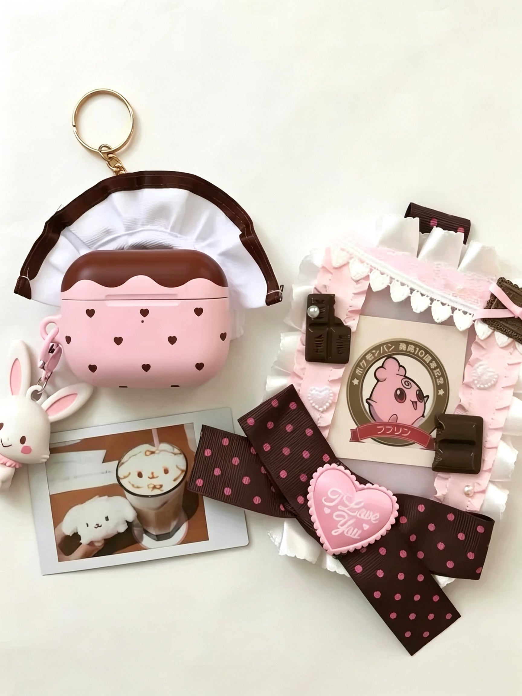 Y2K pink chocolate heart AirPods case with frilly cover and bunny keychain kawaii aesthetic
